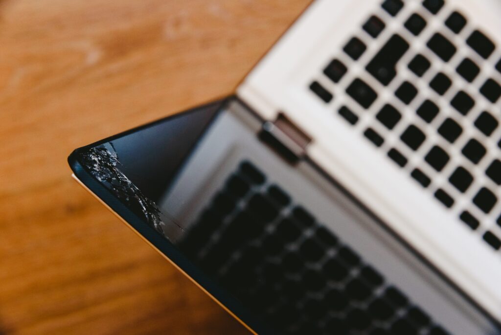 Laptop computer screen with broken glass by accident.